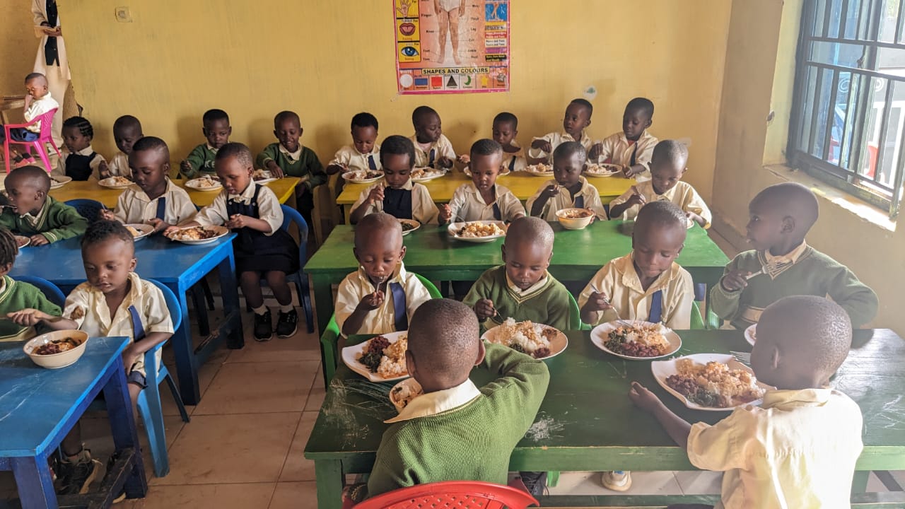 Children sharing a meal in a school dining room